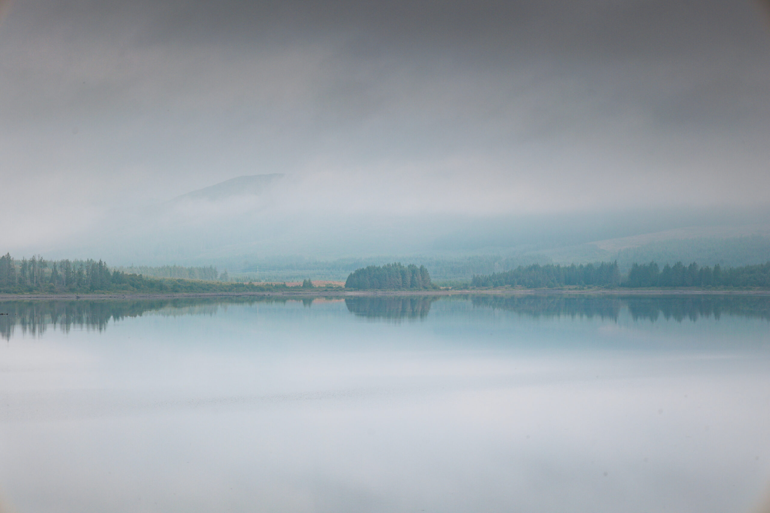 reflections over Clatteringshaws Loch in Galloway Forest Park