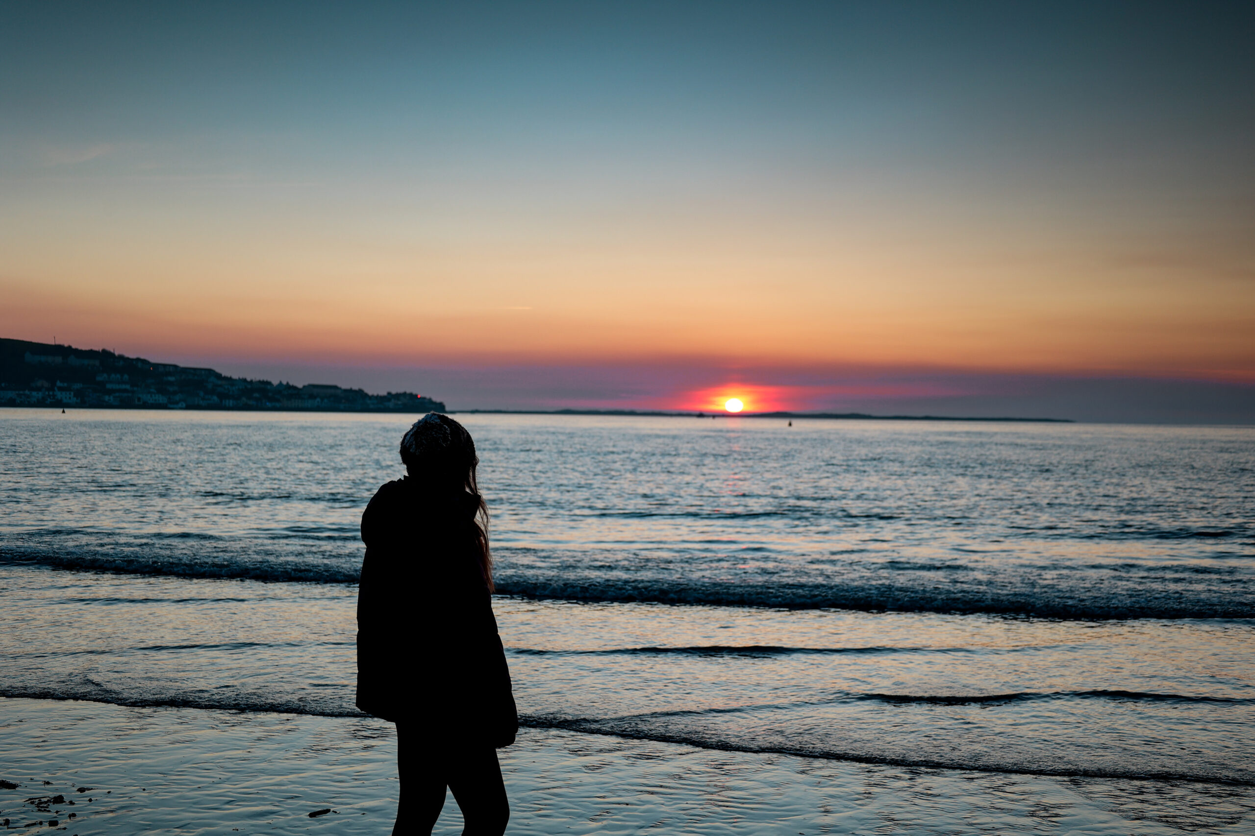 women watching sunset